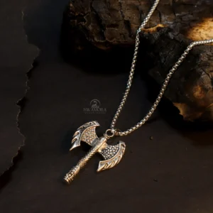 Introducing a powerful and eye-catching necklace for men! This necklace features a uniquely designed Viking axe pendant. The intricate detailing on the pendant and its sturdy construction give it a distinct and impactful look. This necklace is made from high-quality metal and is both stylish and durable. Key Features ⦁ Anti-tarnish The high-quality metal ensures this necklace resists tarnishing and maintains its shine. ⦁ Skin-friendly This material is safe for your skin. ⦁ Long-lasting The sturdy construction and good finish mean this necklace can be worn for a long time. ⦁ The unique Viking axe design gives it a masculine and bold look. ⦁ A great fashion accessory and style statement for men. Give your personality a powerful and unique edge by wearing this specially designed necklace!